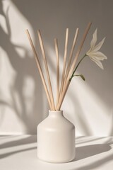 Poster - A simple still life composition of a white vase with a flower and some sticks