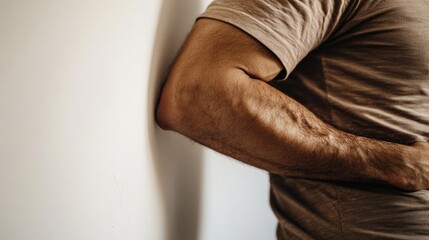 Poster - A person standing with their hands on their hips, leaning against a wall