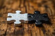 © k - Puzzle Pieces Black and White on Wooden Surface Unity of Opposites