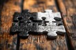 © k - Black and White Puzzle Pieces on Wooden Table Concept of Unity and Cooperation