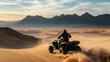 © kaliel - Driver on an ATV crossing a vast desert landscape