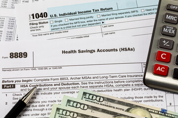 HSA, health savings account, and income tax forms. Tax credit, medical expenses deduction and tax return concept.