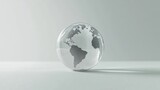 Transparent globe on minimalist background highlighting continents