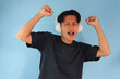 © Lailar Studio - Happy and enjoying young Asian man using headphones listening to music