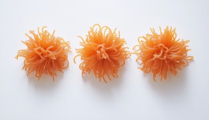 Poster - Vibrant Abstract Orange Sculpture Displayed on White Surface, Featuring Intricate Tangled Patterns and Textures, Ideal for Contemporary Art and Design Themes
