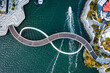 © Matteo Colombo - Aerial drone view of Elizabeth Quay Bridge with infinity symbol shape, Perth, Australia