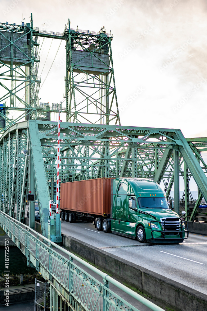 Powerful green big rig semi truck with high cab and grille guard ...
