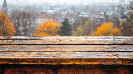 Poster - Autumn town view from wood table.