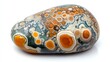 © Nav_ender - Colorful stone with unique patterns, white isolate background.