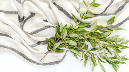 Wall Mural - greenery on striped textile, flat lay, white background, spring decor, website design