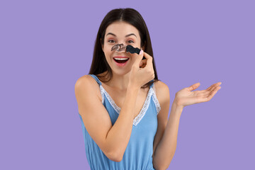 Wall Mural - Young woman removing nose patch on lilac background