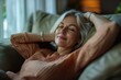 © Anjali - attractive middle aged woman relaxing at home