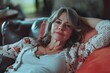 © Anjali - attractive middle aged woman relaxing at home