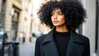 © Tri - Stylish Woman in City Street, Black Coat, Curly Hair