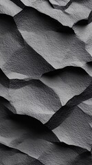 Aufkleber - Abstract textured background featuring dark, rugged surface patterns.