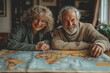 © Chalita - Older couple exploring travel map together planning route adventure travel leisure activity senior citizens wandering discovery journey travel planning relationship bonds outdoors