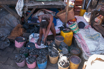  Child selling charcoal