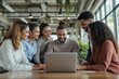 © PlanetOfVectors - A diverse team of professionals smiling and working together on a laptop in a bright, modern office with greenery and large windows. Teamwork concept