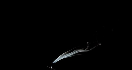 Wall Mural - Real smoke on a black background. Thin Flexible Trickle of Real Smoke. Colorful real smoke rises up. Ideal for background or over-layer with blending mode add, screen, lighten.