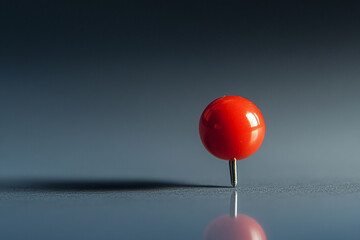 Poster - Minimalist red pushpin standing on reflective surface with gradient background