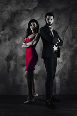 Poster - Full size fullbody vertical portrait of attractive, confident couple with crossed arms looking at camera pretty slim lady purple tight dress gentlemen in tux standing over grey wall