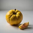 © Muhammad - A quince fruit with its unique yellow tone on a white backdrop.