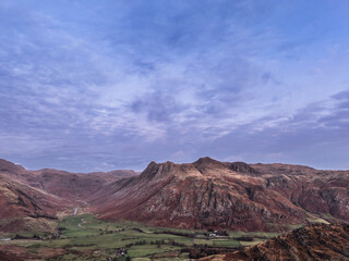 Wall Mural - Beautiful aerial drone landscape image of Blea Tarn and Langdale Valley in Lake District during vibrant Autumn sunrise