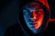 © Pattra - Intense Portrait of a Young Man in a Hood with Dramatic Lighting