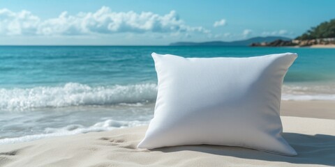 Aufkleber - A white pillow contrasting against the backdrop of a blue sea in a beach setting creates a serene and visual experience of coastal tranquility.
