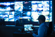 © SAHARAT - Security guards are monitoring multiple CCTV monitors and reporting on events that occur.
