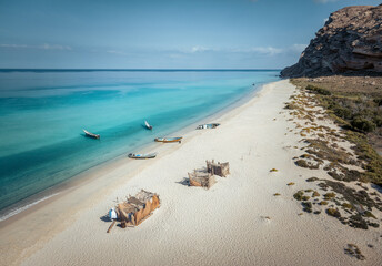 Aerial view of the breathtaking landscape of abandoned beach Shoab, one of the most beautiful beaches in the world, with turquoise waters of Arabian Sea and white sand beach. Socotra, Yemen. 