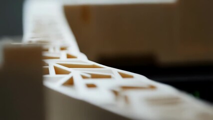 Poster - Architectural model slowly rotating on a build platform, showcasing intricate details and design elements, highlighting the precision and capabilities of additive manufacturing technology