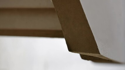 Aufkleber - Architectural detail showcasing a precisely aligned gutter joint connection. Emphasizing the seamless overlap and integration of two segments. Highlighting precision in modern construction techniques