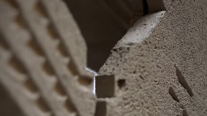 Aufkleber - Close up view reveals the texture and bonding of interlocking concrete layers in a construction setting, highlighting the precision and strength of prefabricated elements