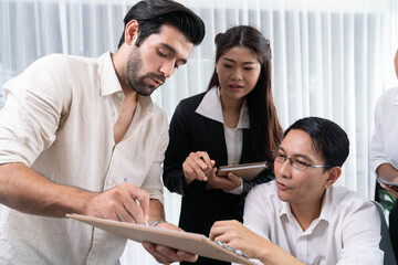 Group of diverse office worker employee working together on strategic business marketing planning in corporate office room. Positive teamwork in business workplace concept. Prudent