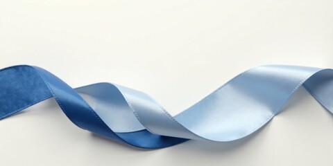 Fototapete - Elegant Blue and Light Blue Satin Ribbon Swirl on White Background