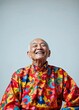 © rfassets - Happy Senior in Vibrant Floral Robe