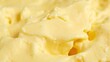 © GMeta - Creamy churned butter with golden hues forming soft peaks and valleys Warm and indulgent