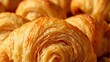 © GMeta - Close up of golden flaky croissant layers revealing buttery interior in warm light Rich appetizing texture