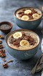 © Sergey - Creamy banana smoothie bowl topped with granola and chia seeds. Healthy breakfast or snack.