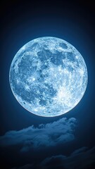 a large blue moon is in the sky with a cloudy background