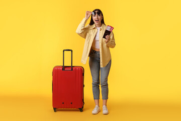 Sticker - Woman with tickets, passport and suitcase on orange background