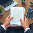 © Mtaufiq - Businessman Reviewing Documents at Desk