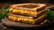© Diki - A perfectly toasted grilled cheese sandwich with melted cheese filling