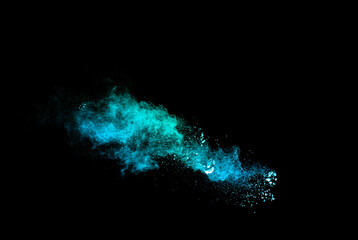 Wall Mural - Green Color Powder Explosion Cloud On Black Background. Green Dust Splash On Dark Background.