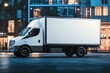 © Marica - White delivery truck parked in modern urban city street near glass building