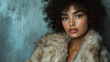 © mahamad - A model posing in a faux fur jacket.