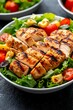© Sansern - Fresh Grilled Chicken Salad with Vibrant Vegetables and Herbs