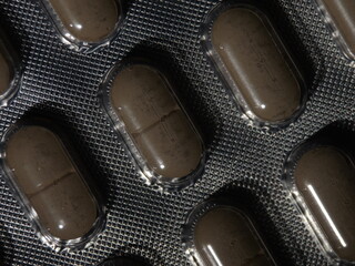 Poster - A close up of pills on a plastic tray
