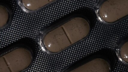 Poster - A close up of pills on a plastic tray